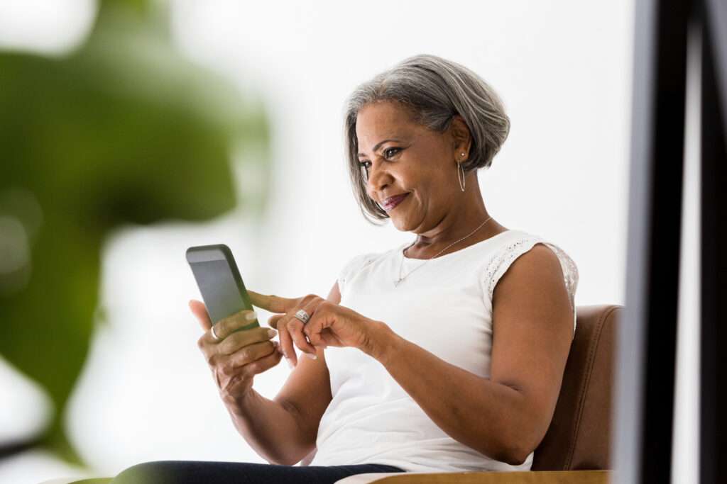 woman using patient engagement software to book healthcare appointment