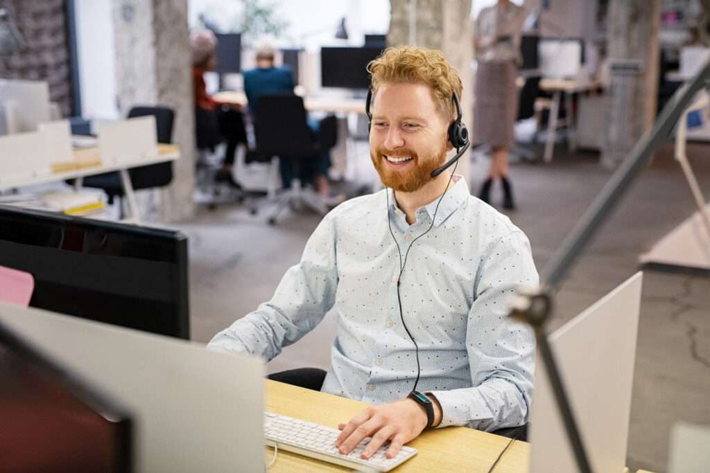 man at desk providing Patient Engagement Platform support