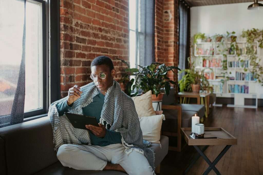 african american man using tablet for electronic medical forms