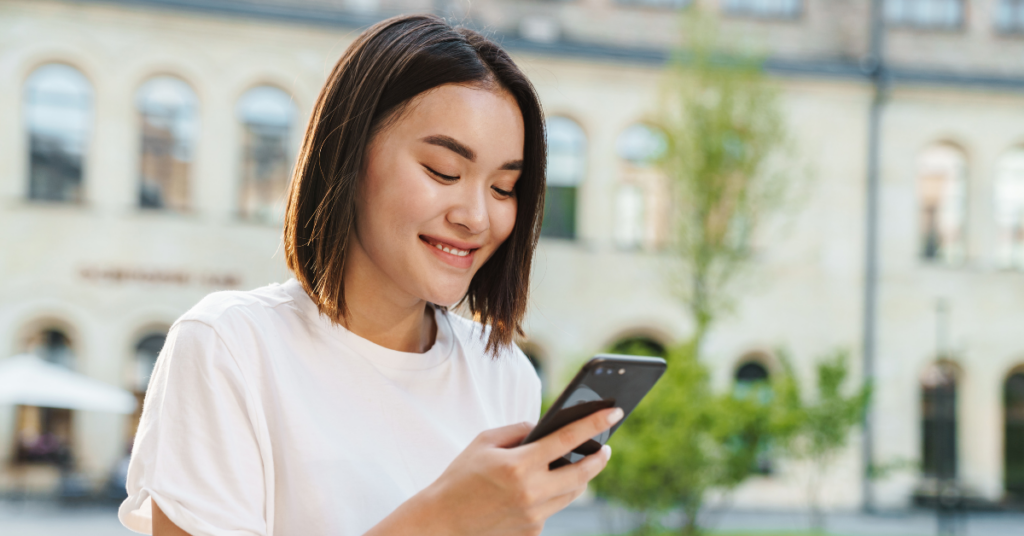 Woman using mobile phone engaging in patient communication