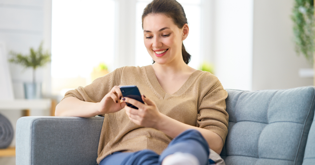 young woman using mobile phone for patient scheduling