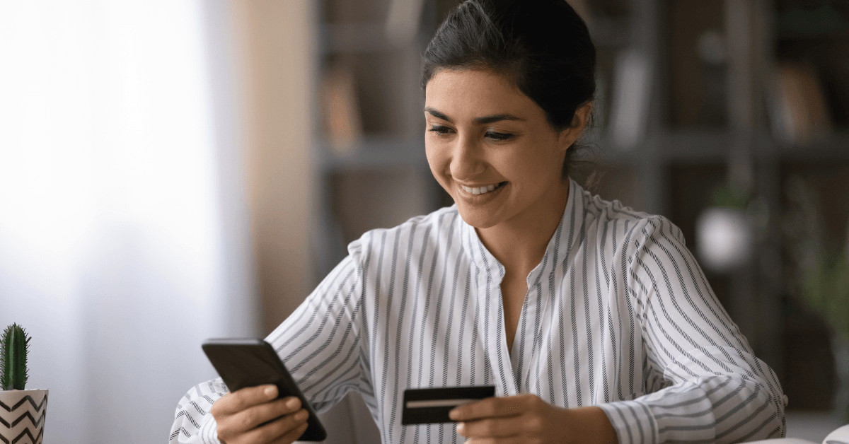 Woman using mobile phone for patient co-payments